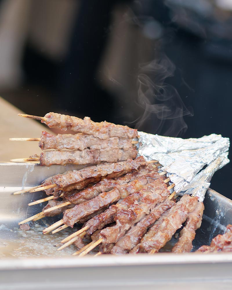 Traditional arrosticini cooking