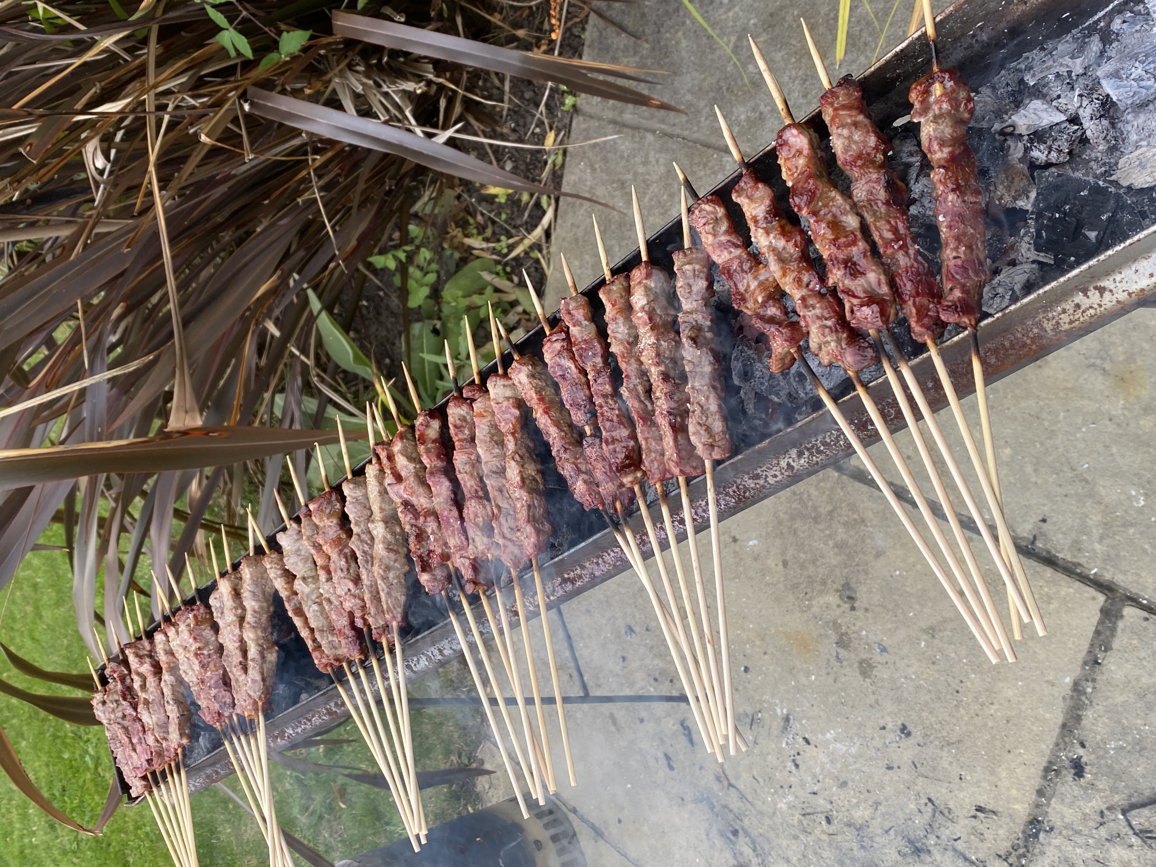 Traditional arrosticini cooking