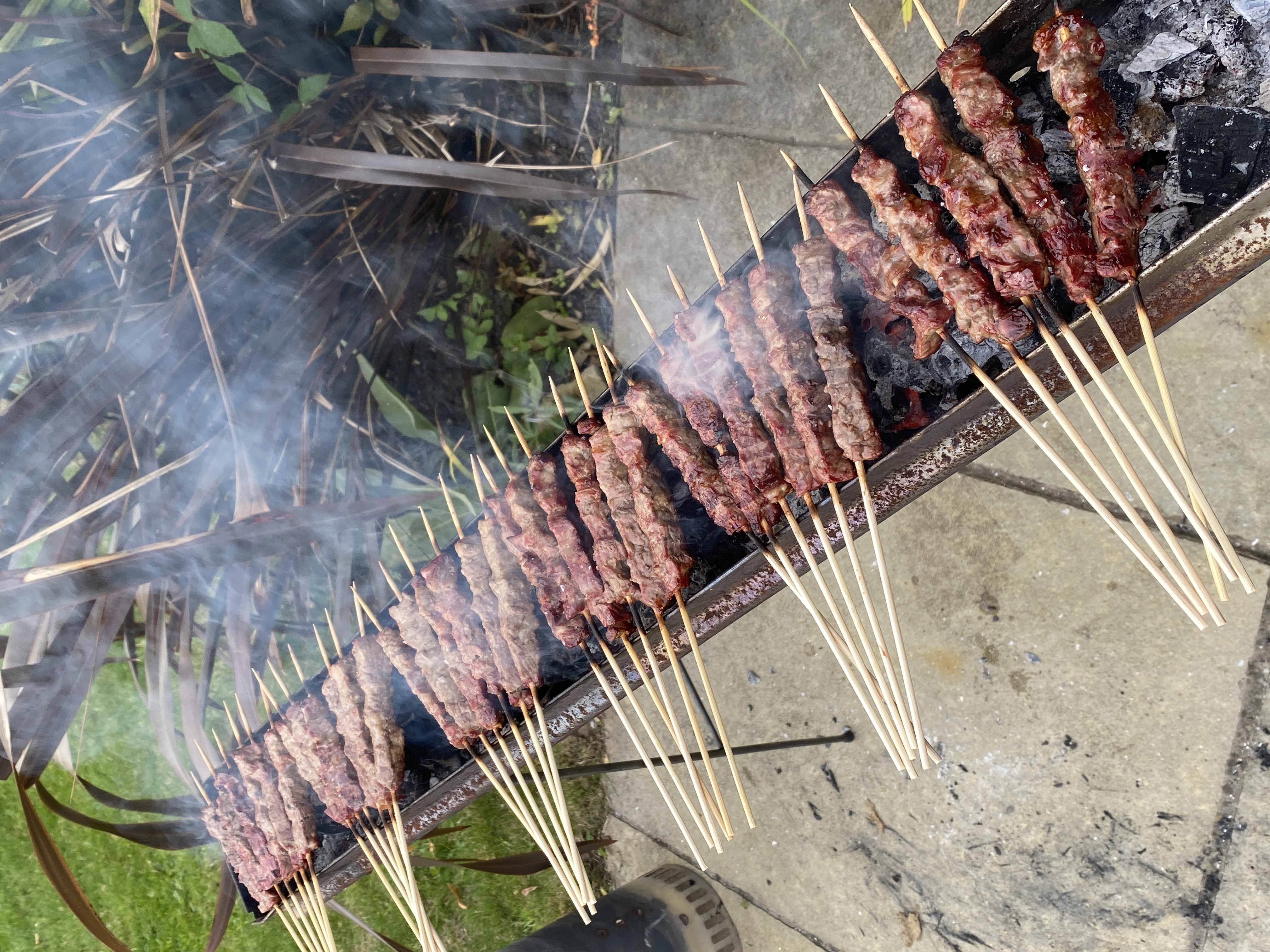 Arrosticini cooking over fire